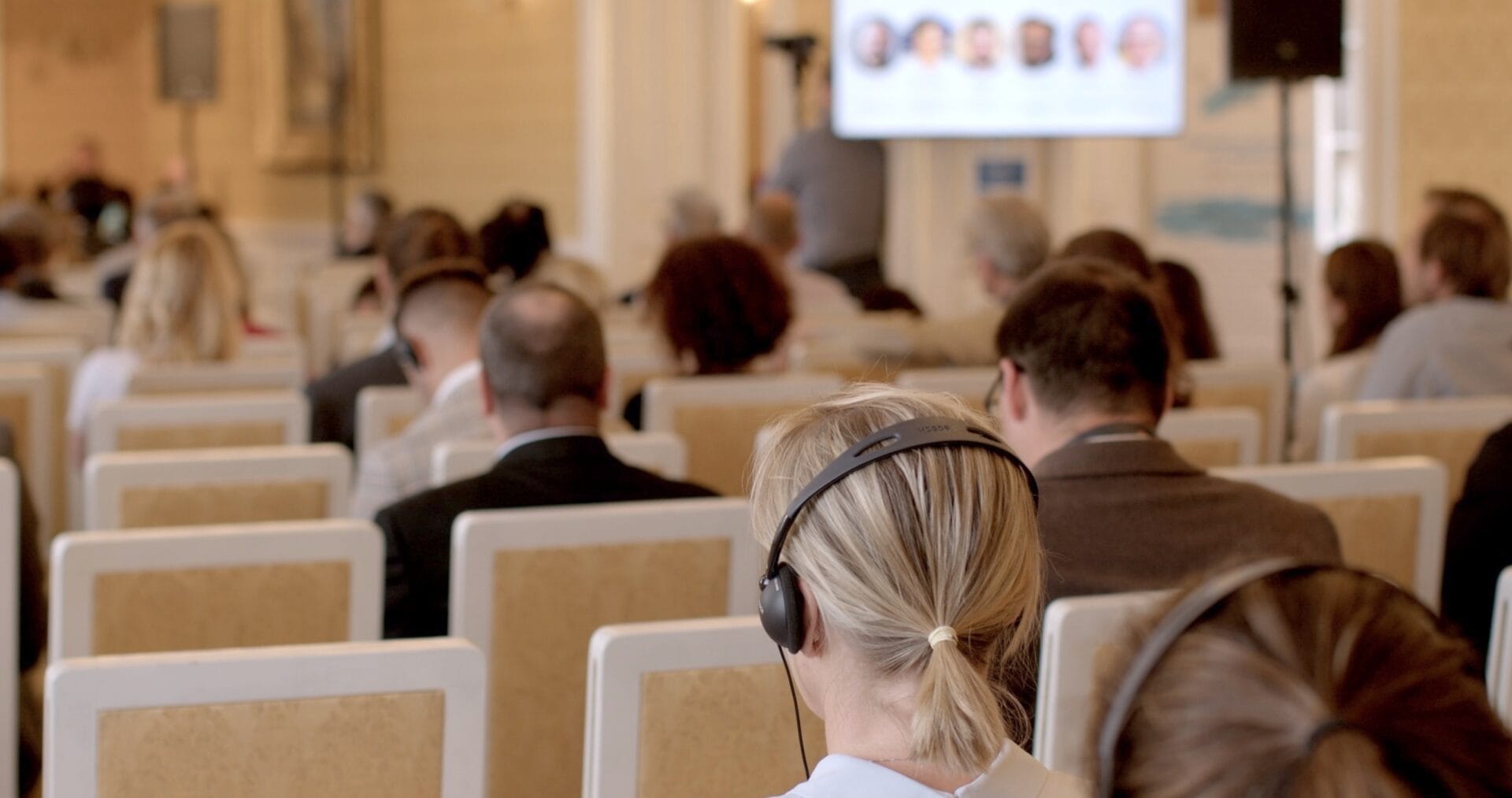 People,Using,Headphones,Simultaneous,Translation,International,Conference.,Importance,Global,Communication